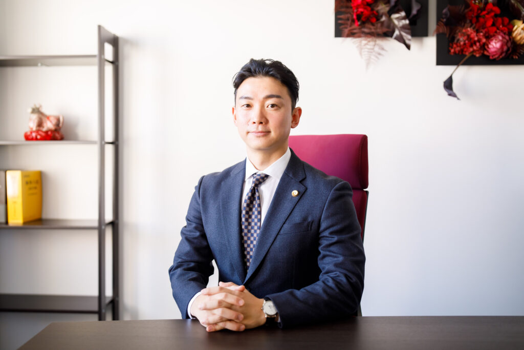 都 裕記弁護士